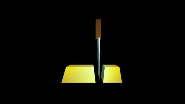 Gold Ingot Being Cut